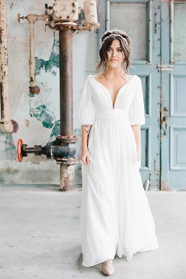 Graceful A-line V-neck chiffon wedding dress with half-sleeves.