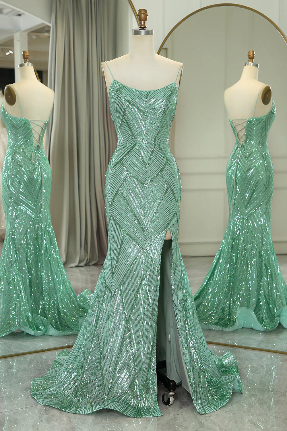 Elegant green mermaid prom dress with spaghetti straps and criss-cross back.