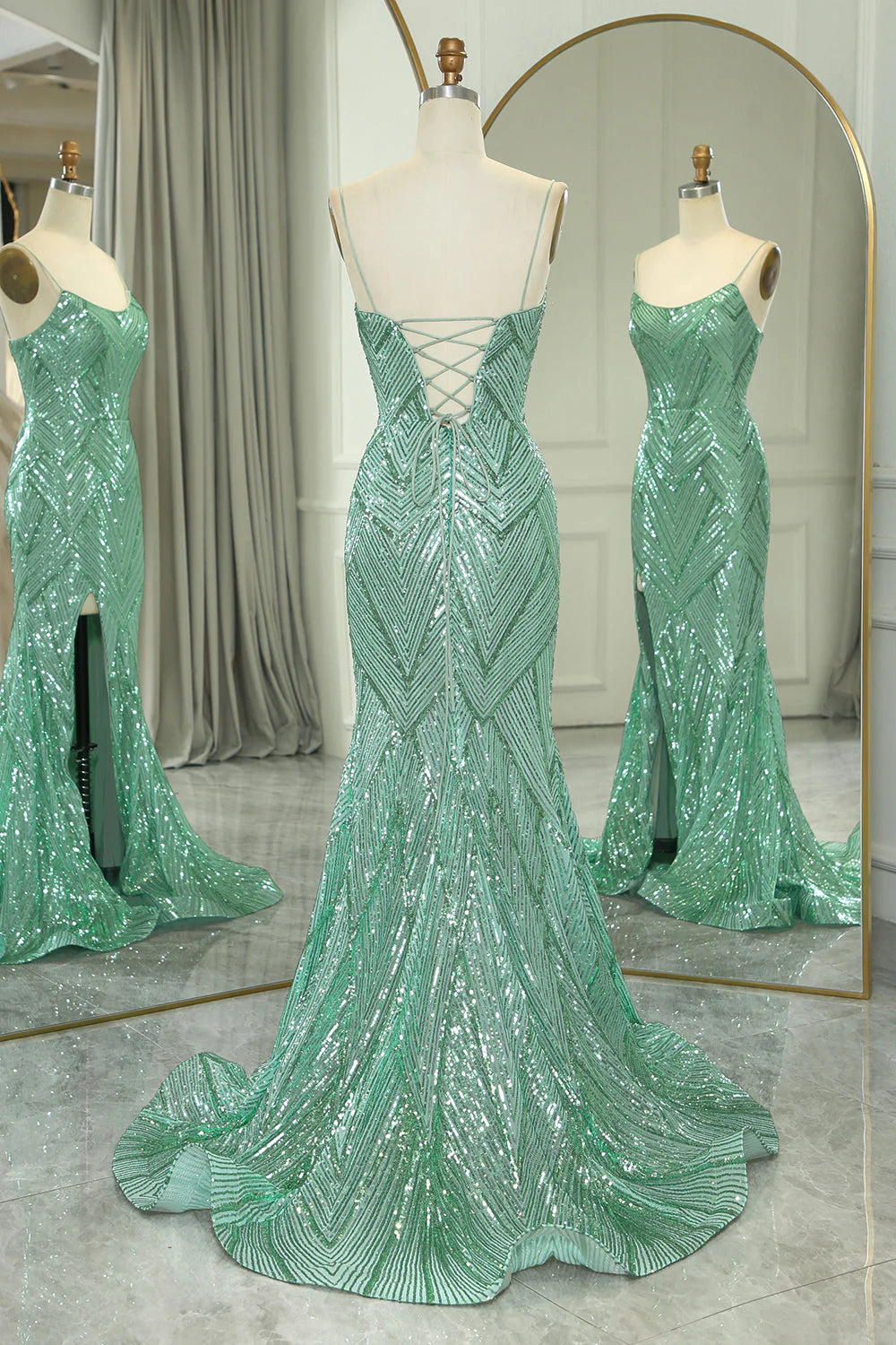 Back view of a green mermaid prom dress showing criss-cross straps.