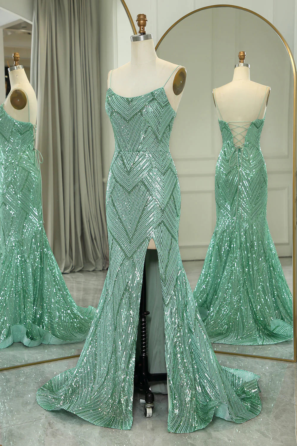 Side profile of a green mermaid prom dress, highlighting the flowing silhouette.