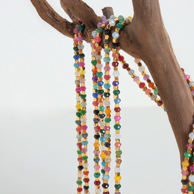 Detailed view of the titanium steel chain and tourmaline beads.
