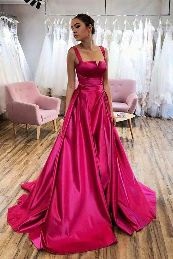 Model wearing a hot pink A-line satin V-neck long prom dress with a court train.
