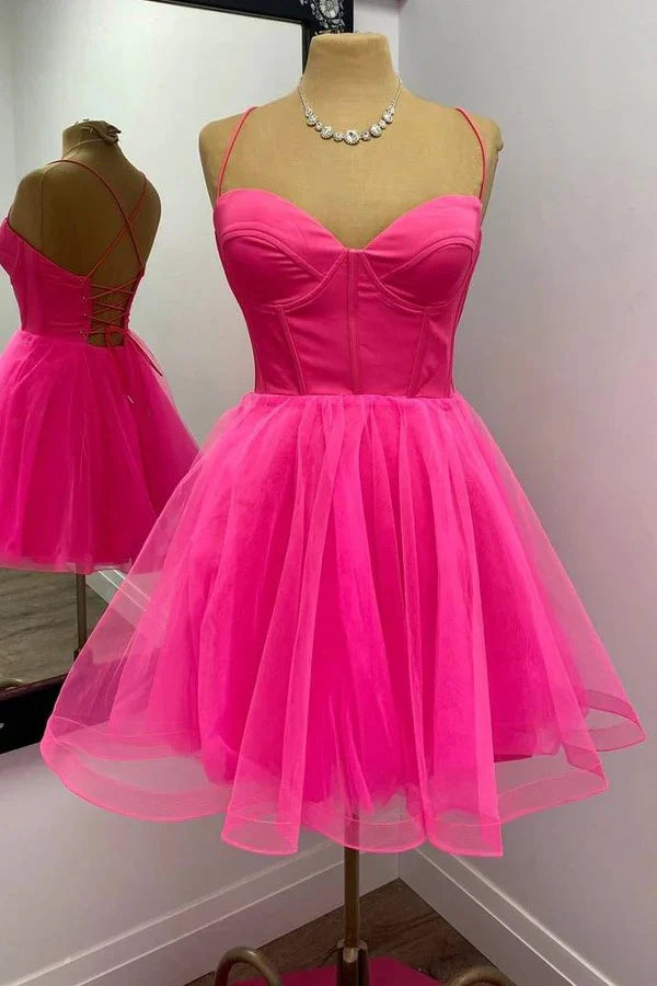 Hot pink A-line short homecoming dress with V-neck and lace-up back.