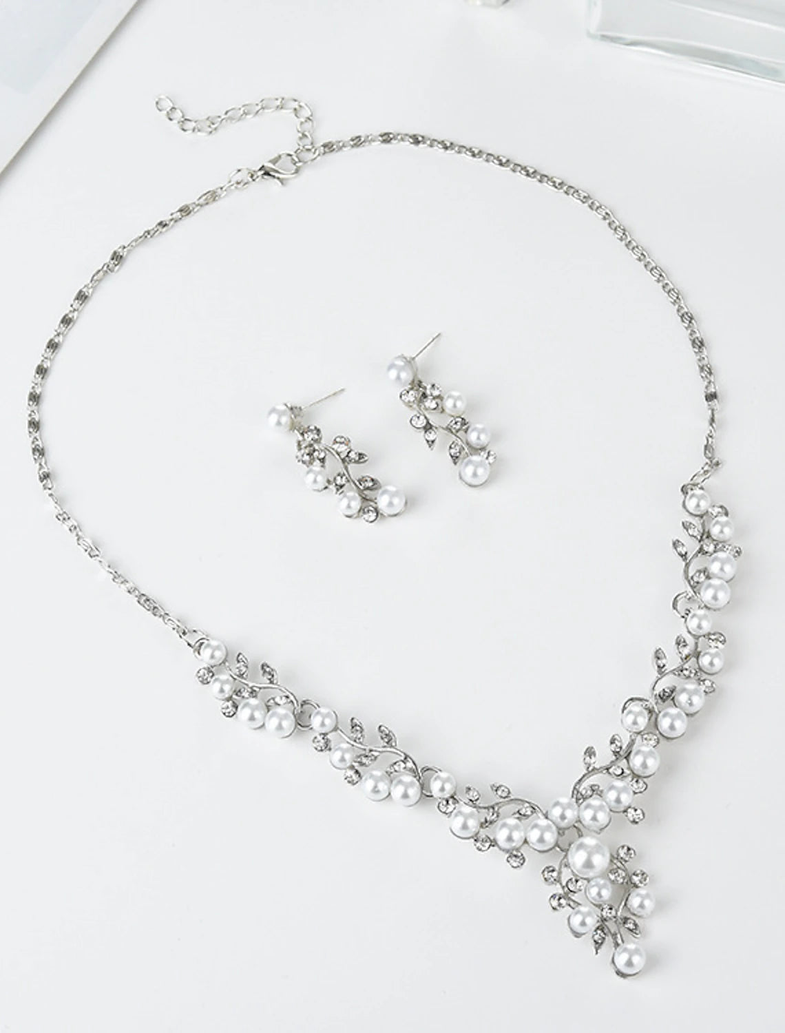 Imitation pearl hoop earrings and matching necklace set.