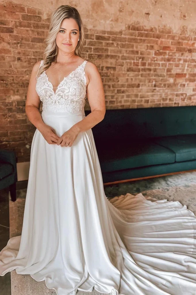 Front view of an ivory A-line floral lace wedding dress with a V-neckline.