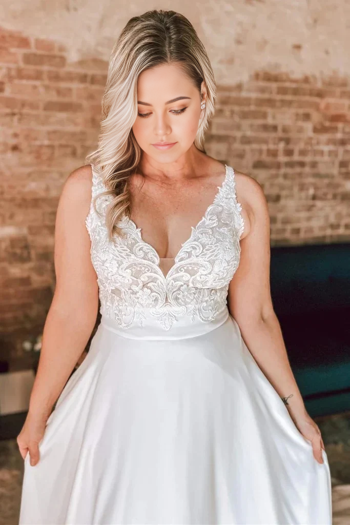 Back view of the ivory A-line floral lace wedding dress, highlighting the open back detail.