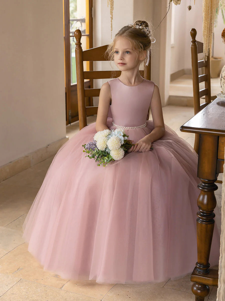 Back view of ivory flower girl dress showing satin bowknot.