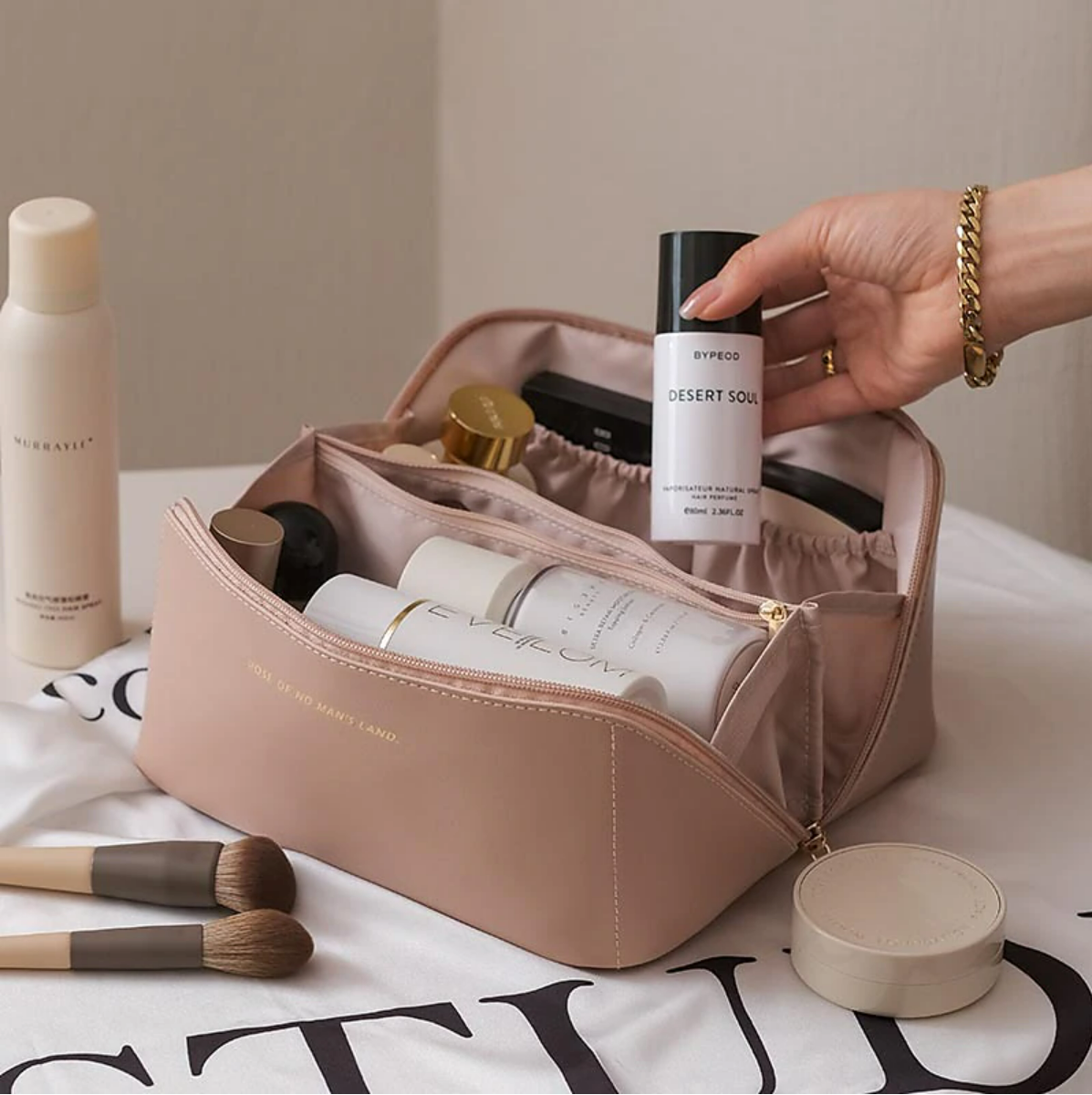 Waterproof PU leather makeup toiletry bag from a side view, highlighting the handle.