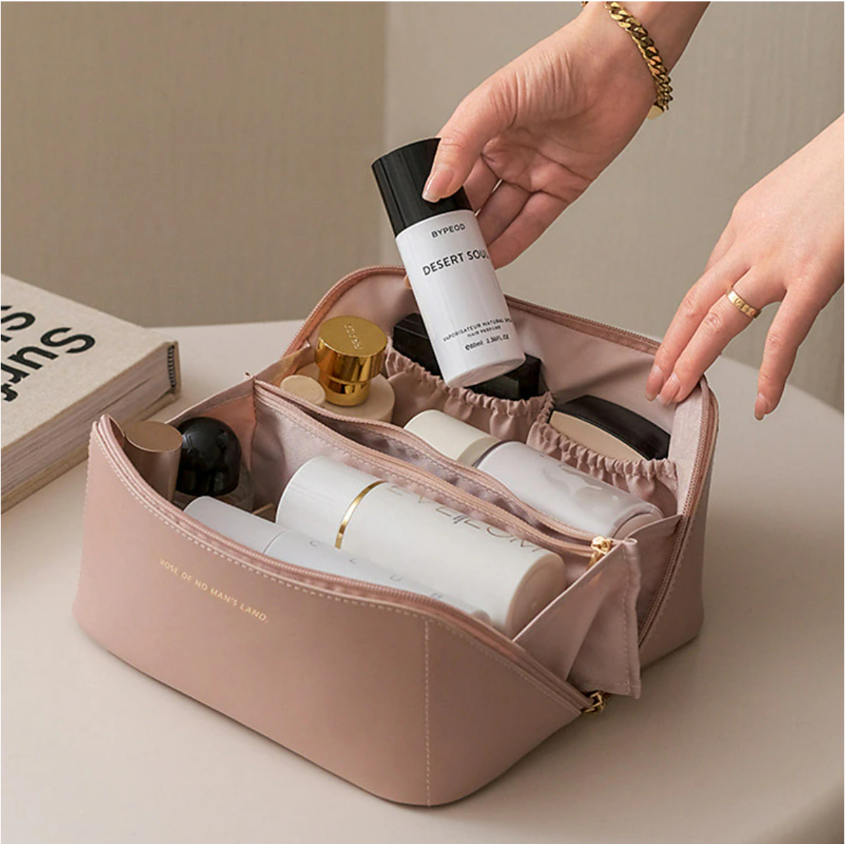 Detail of the waterproof PU leather texture and zipper closure on the cosmetic bag.