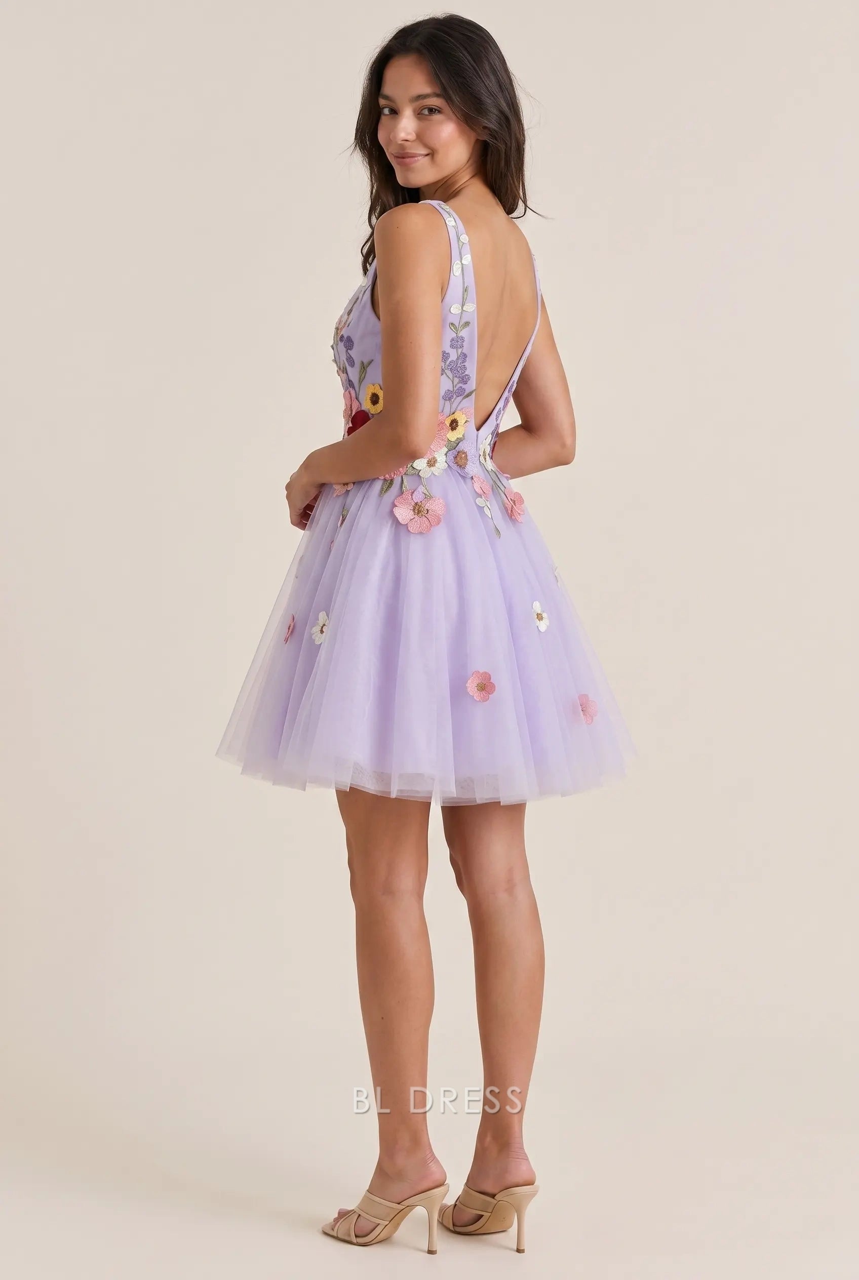 Close-up of the multicolor 3D floral appliqués on the bodice of the lavender tulle dress.