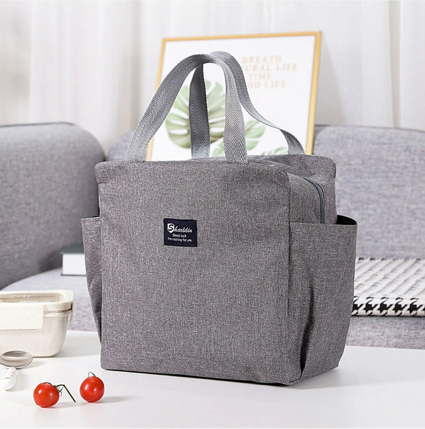 Insulated lunch bag on a desk, ready for work.