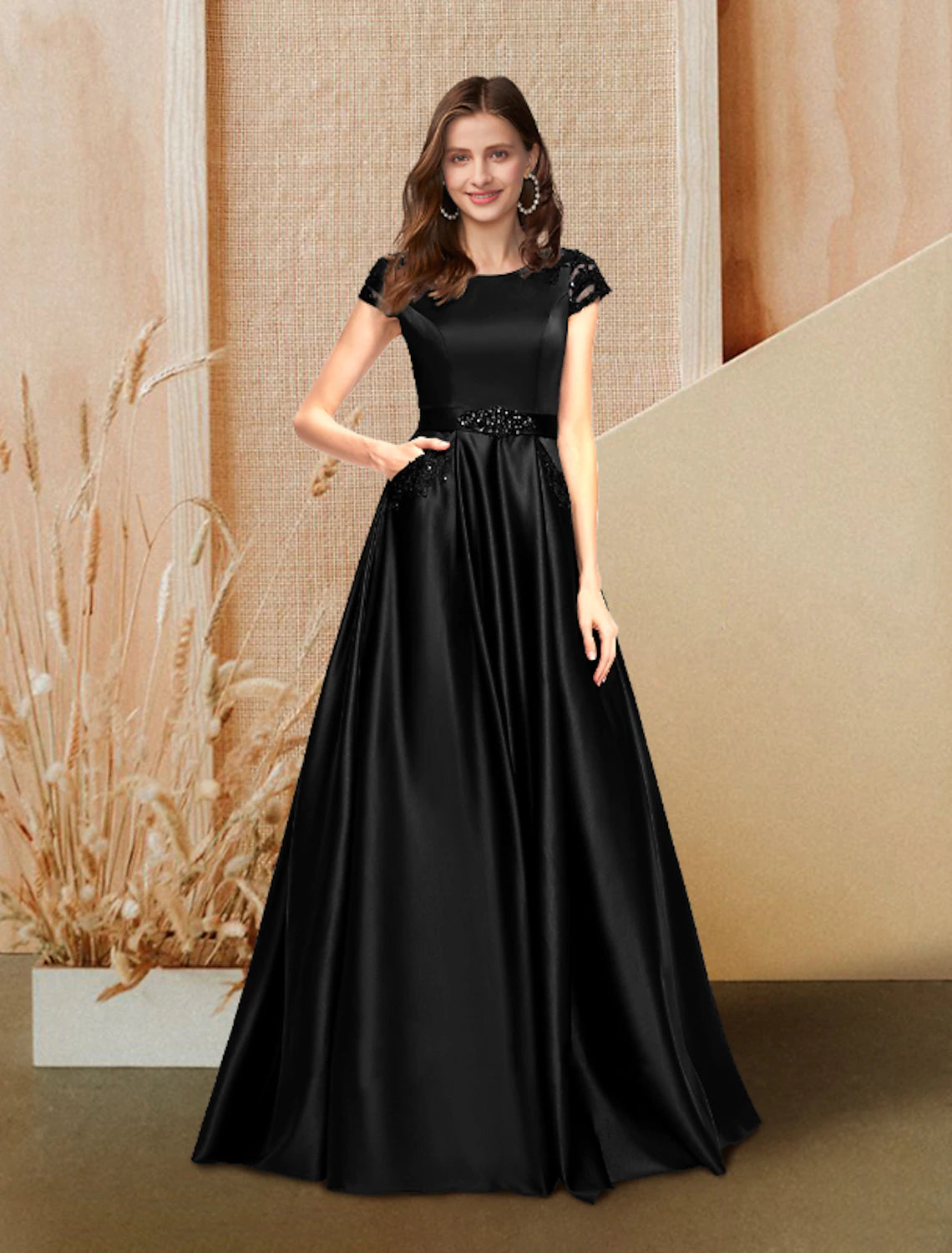 A-Line evening gown with jewel neck, short sleeves, and floor-length satin skirt.