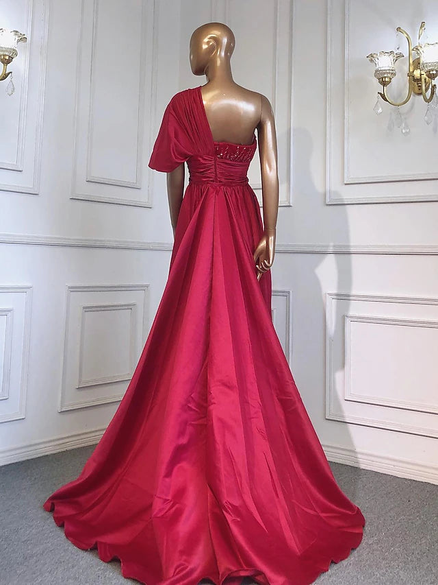Detail of the sparkling crystals and soft ruching on the luxurious charmeuse evening gown.