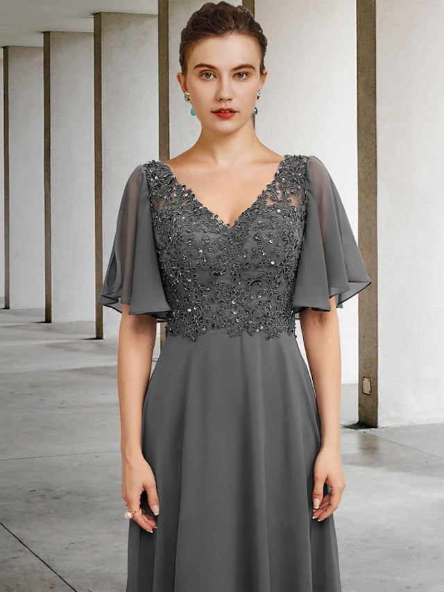 Close-up of chiffon lace and beading appliques on the formal dress.