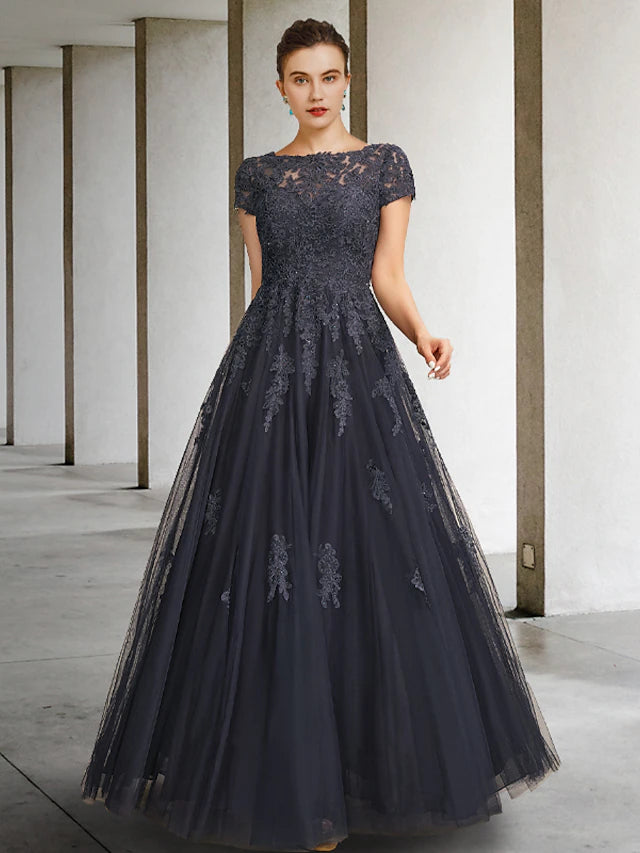 Front view of a luxurious floor-length ball gown mother of the bride dress with jewel neck and short sleeves, featuring lace.