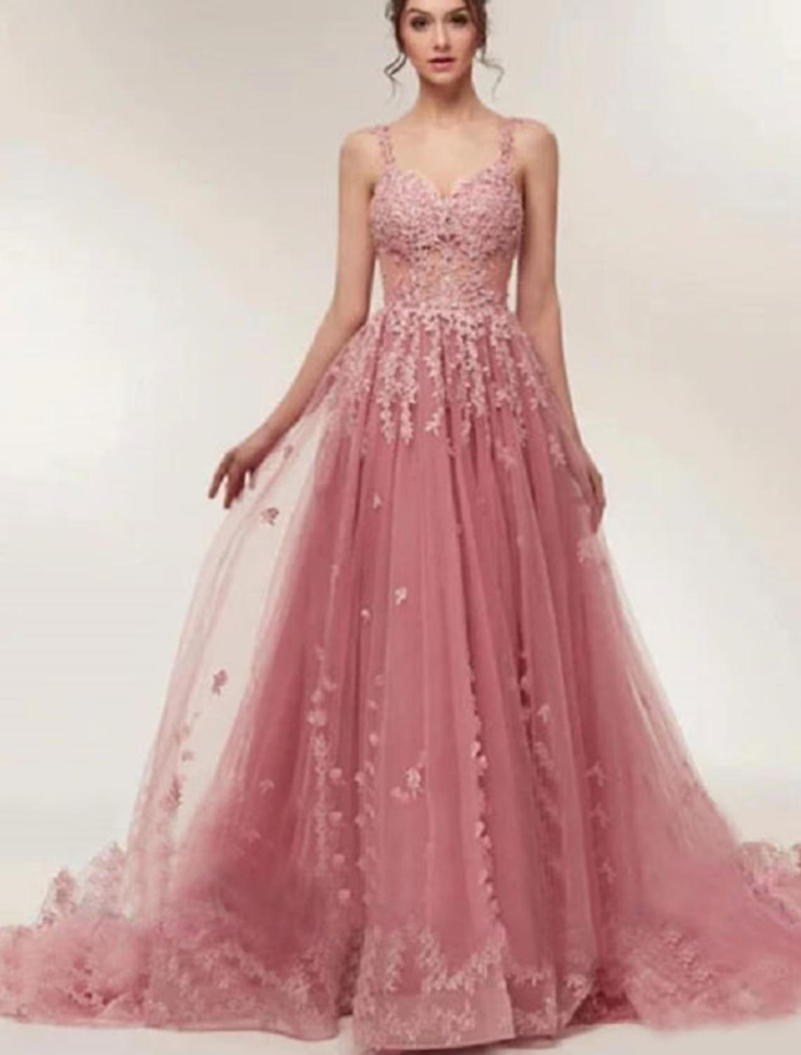 Luxurious V-neck ball gown with appliques and court train, front view.