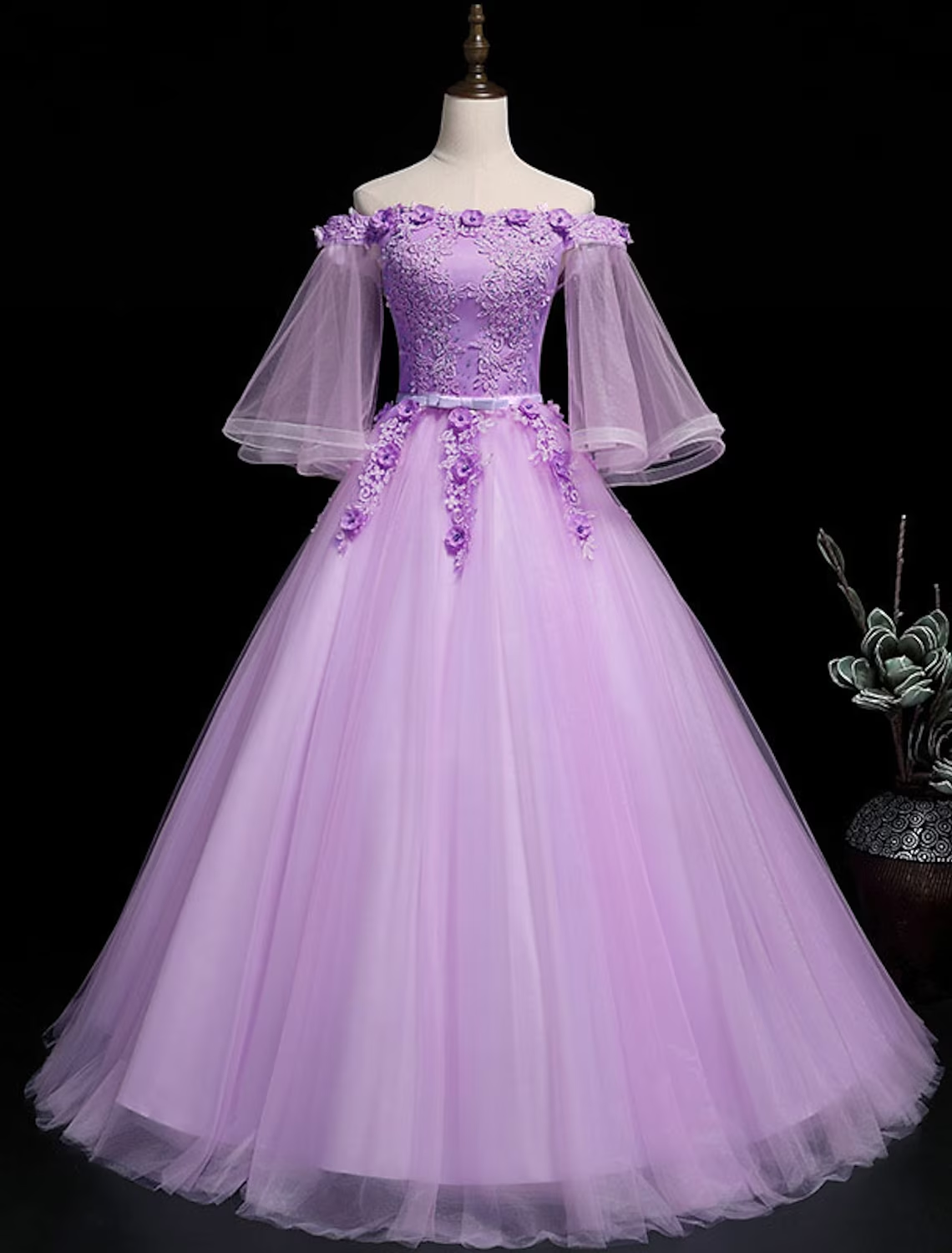 Luxurious floral off-shoulder ball gown with 3/4 sleeves and ribbon embroidery.