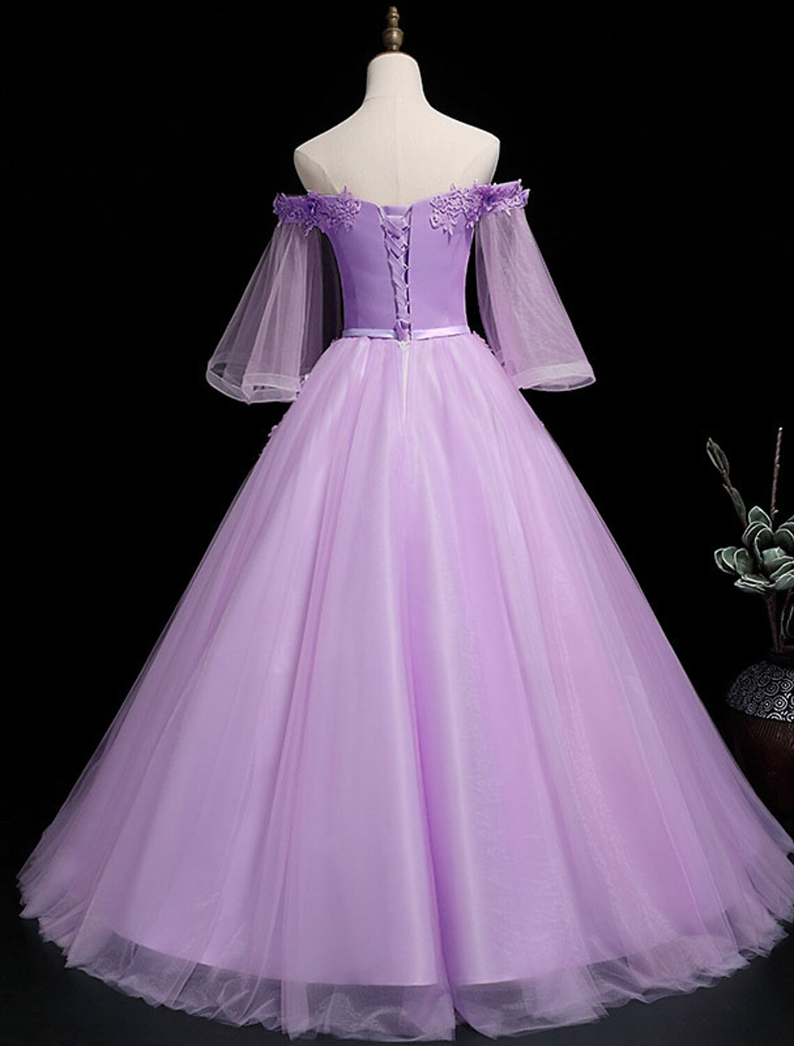 Back view of the floral off-shoulder Quinceanera dress with floor-length tulle.