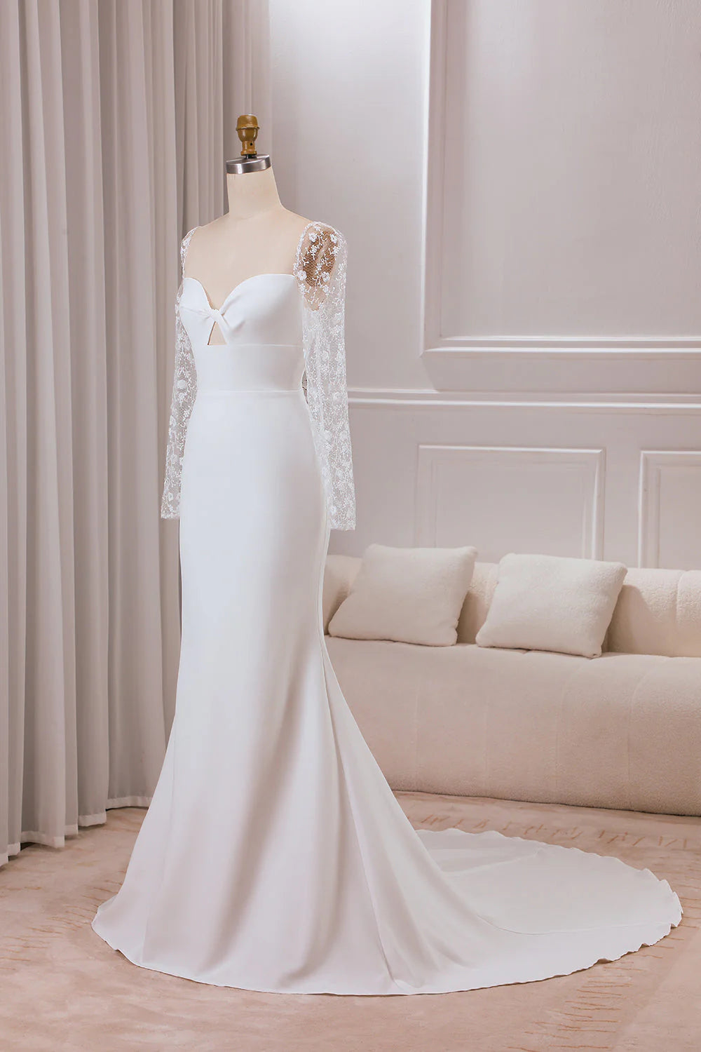 Side profile of the ivory satin trumpet wedding dress, highlighting the silhouette.