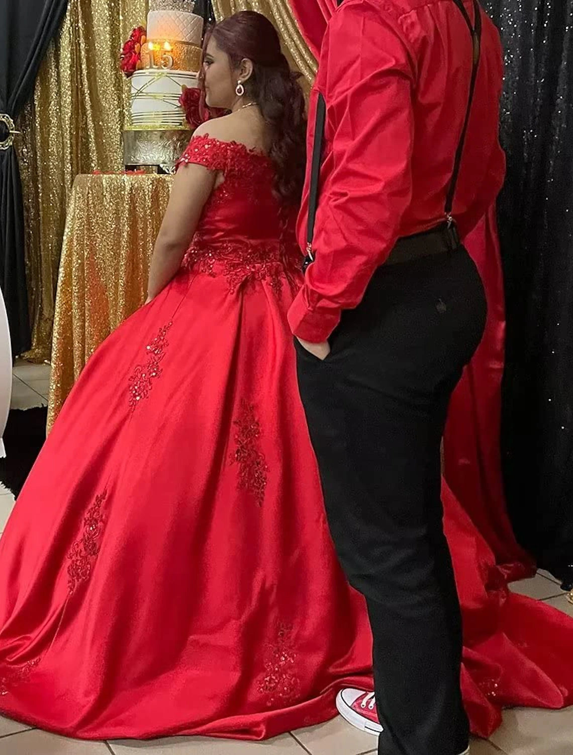 Model posing gracefully in the off-shoulder short sleeve ball gown.
