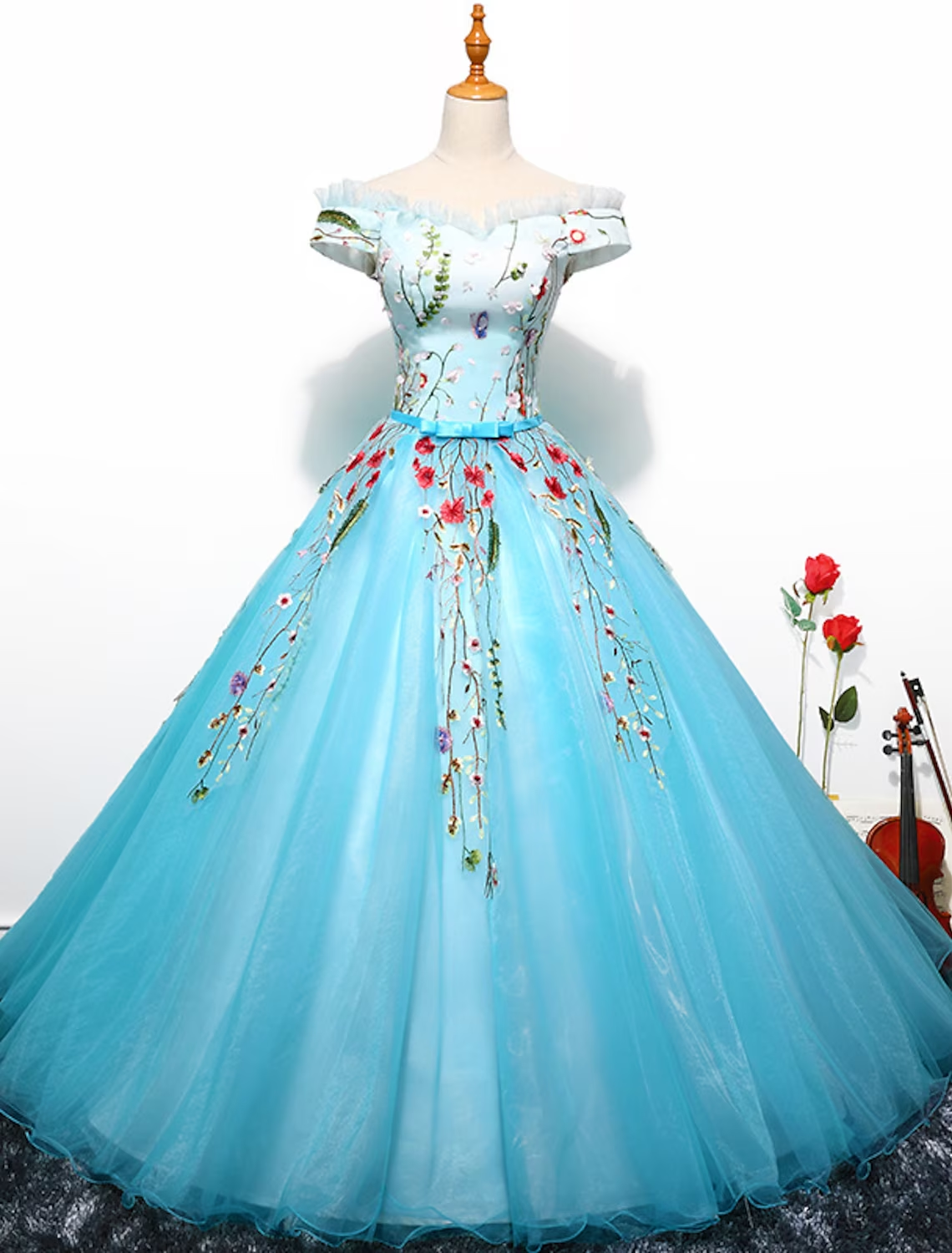 Luxurious off-shoulder short sleeve ball gown with pleats and embroidery.