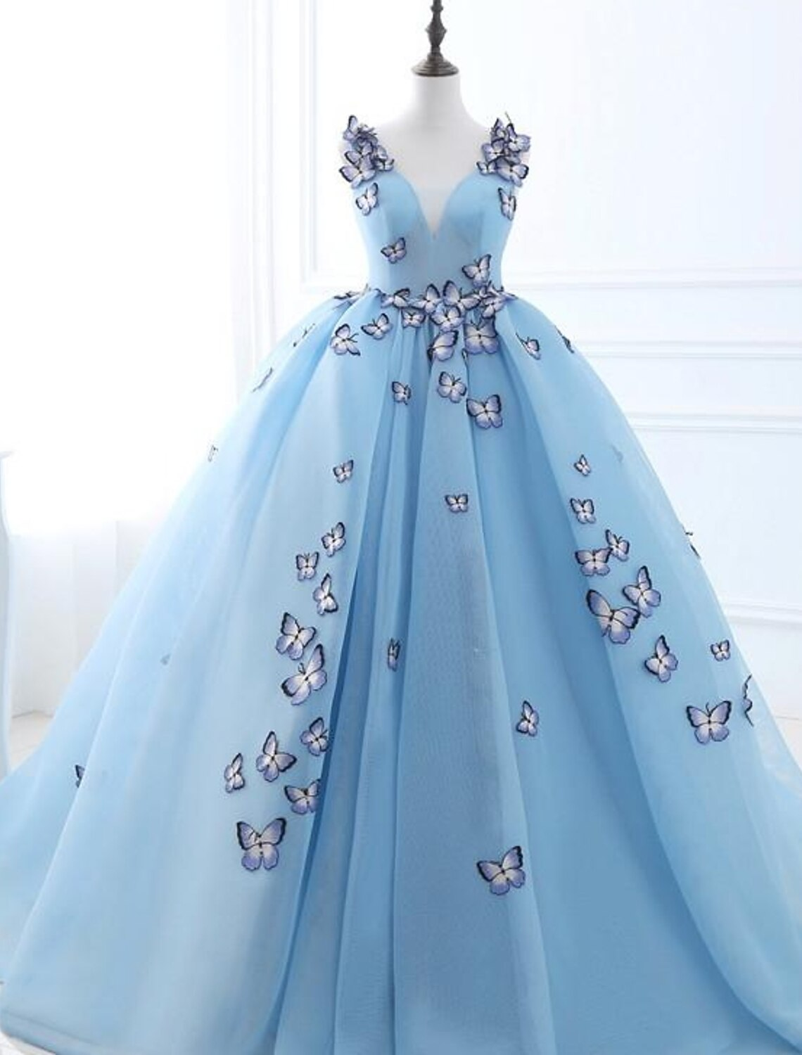 Elegant V-neck ball gown prom dress with appliques and court train.