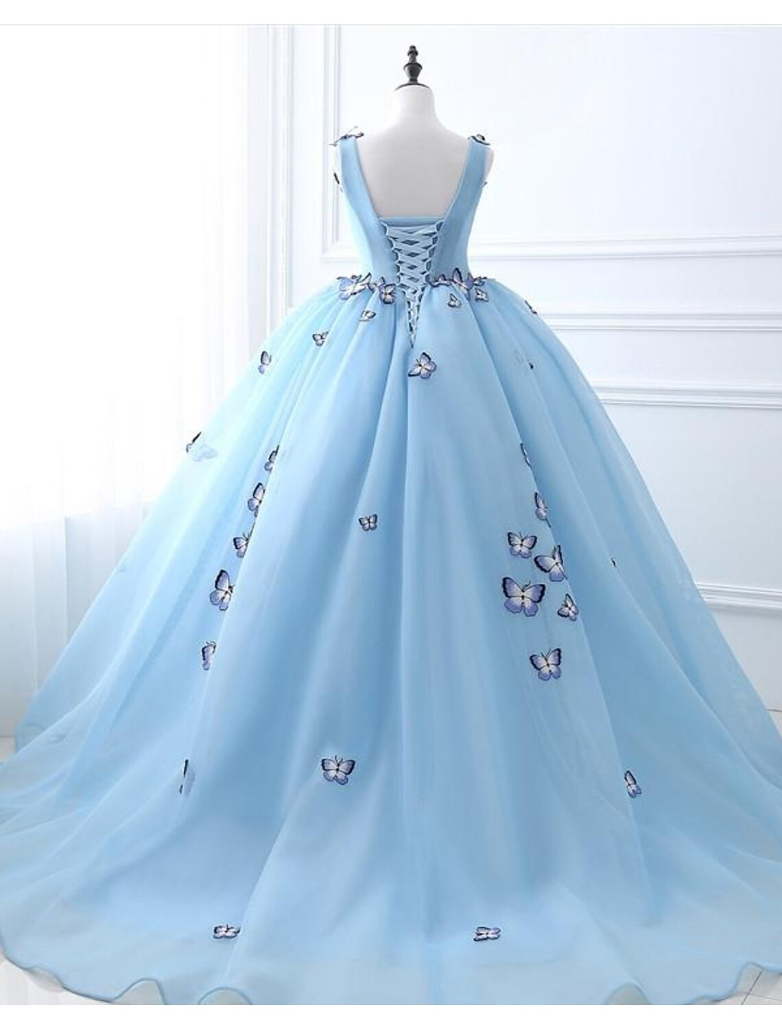 Full length view of the ball gown prom dress, highlighting the tulle fabric.