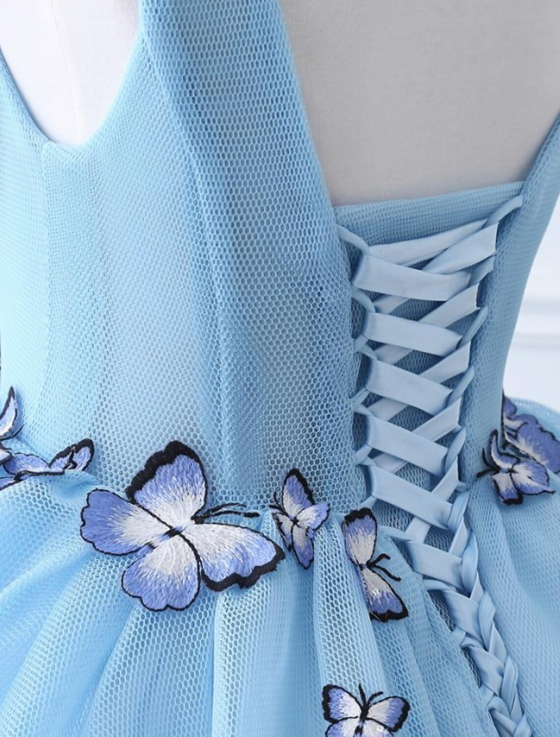 Detailed view of the court train and appliques on the luxurious ball gown.