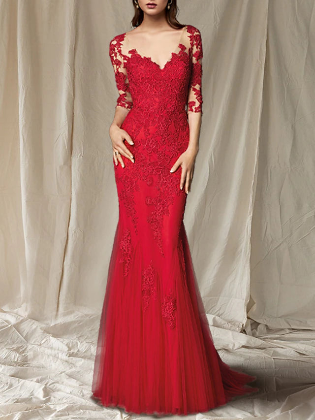 Close-up of lace and applique details on a half-sleeve mother of the bride gown.
