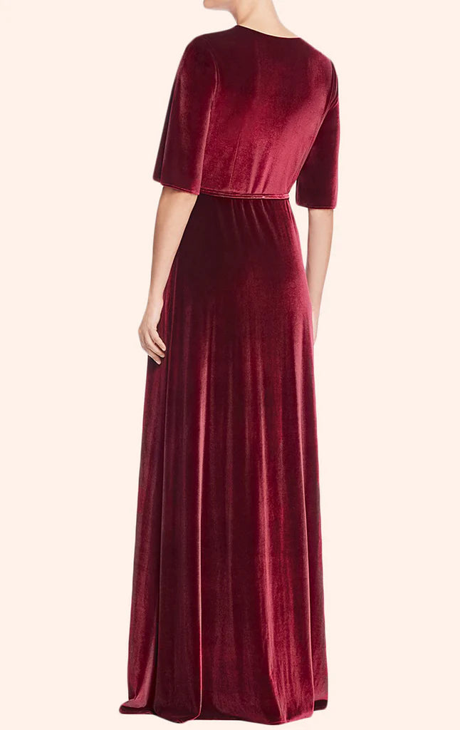 Model showcasing a sleeveless velvet formal party dress.