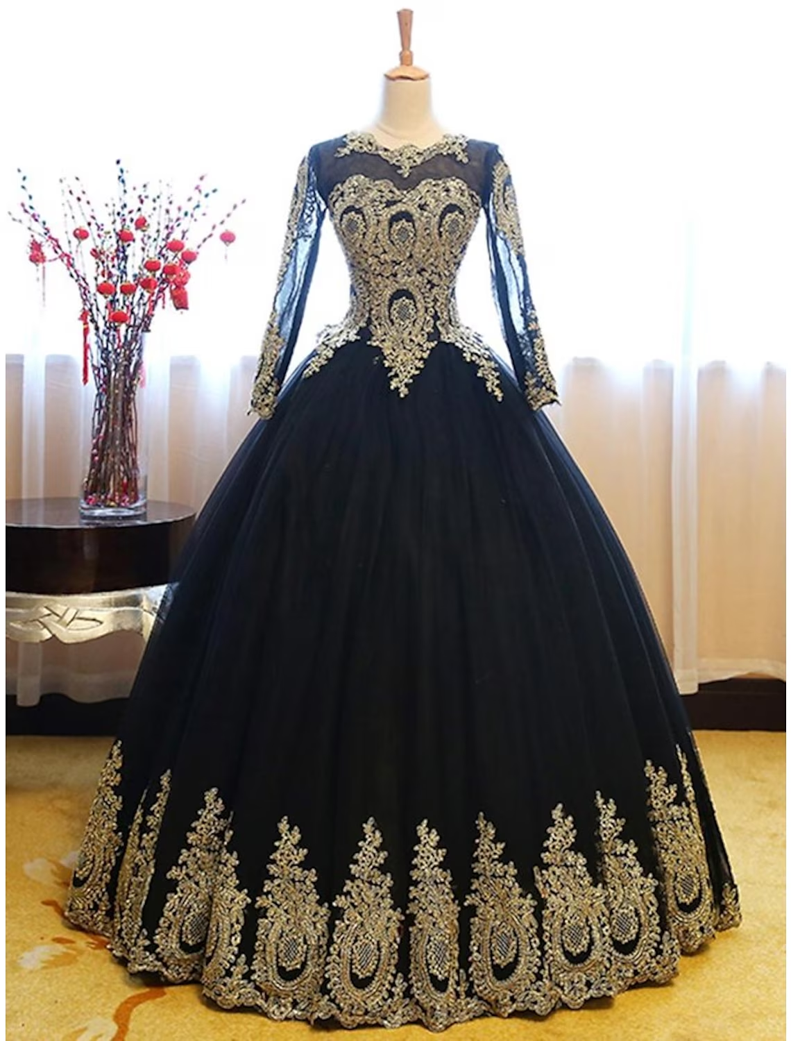 Luxurious vintage Quinceanera ball gown with jewel neck and long sleeves.