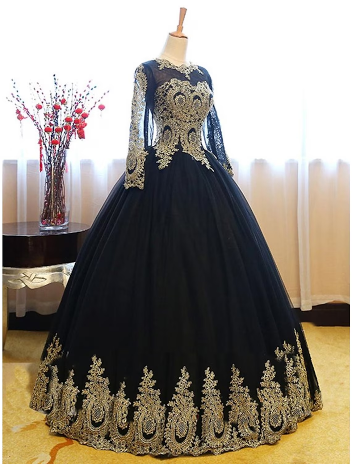 Close-up of intricate lace and applique details on the formal evening dress.