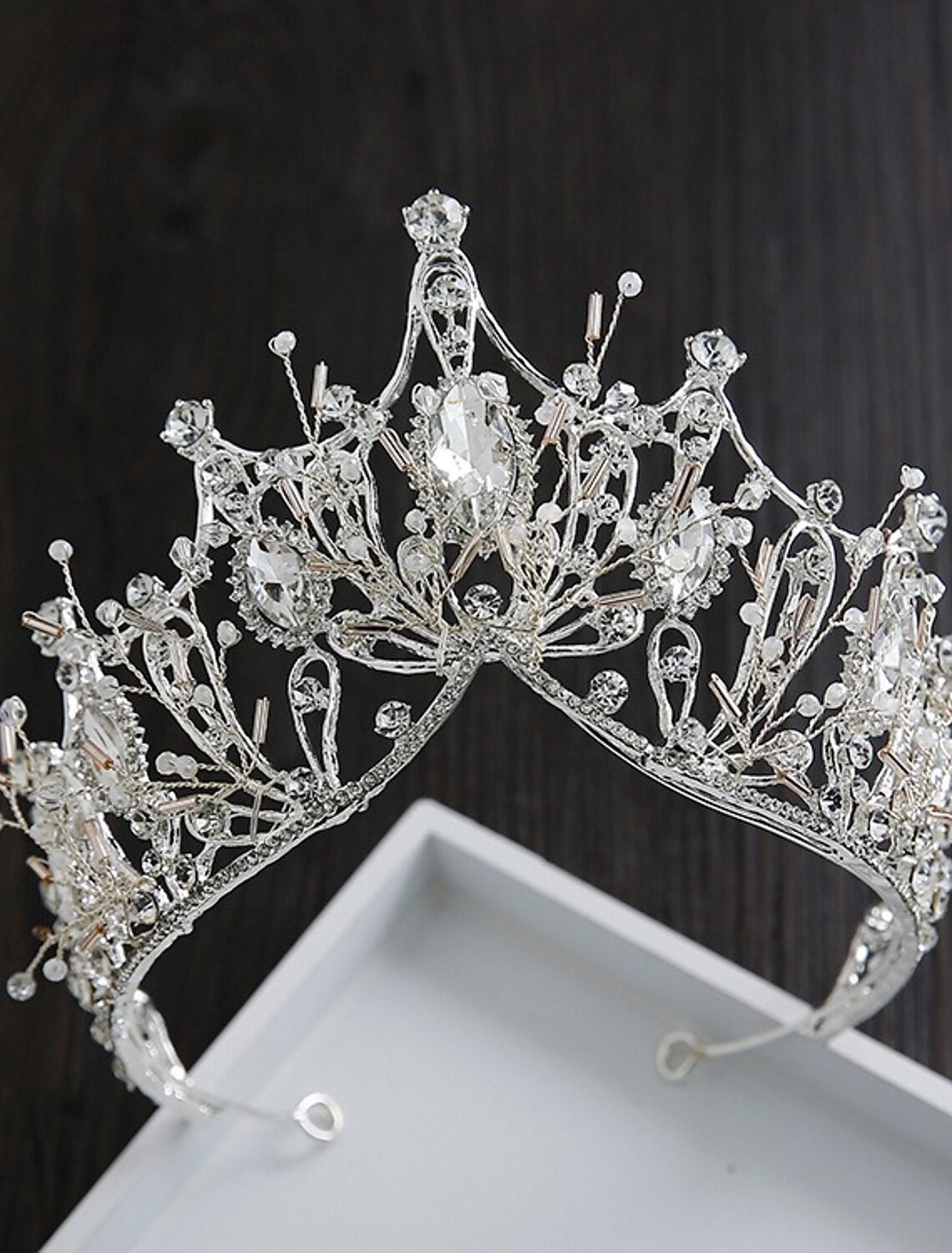 Elegant wedding tiara with pearls and crystals on a white background.