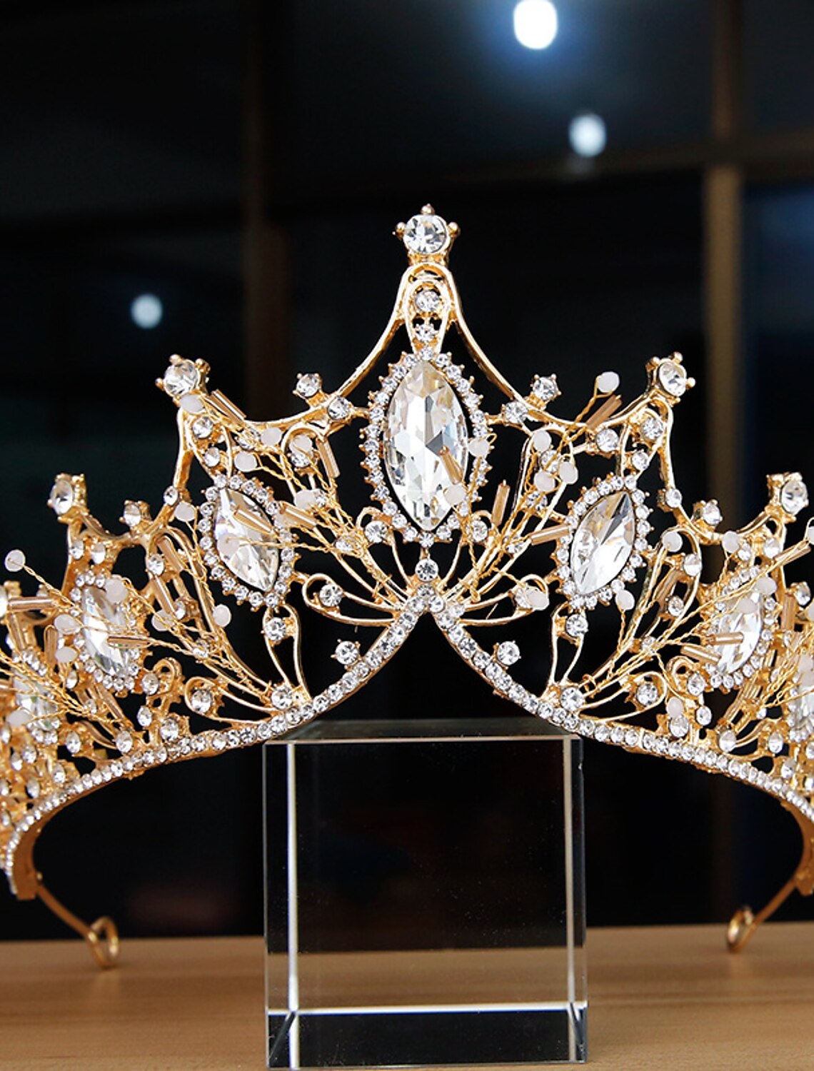 Close-up of a luxurious bridal crown featuring intricate pearl and crystal details.
