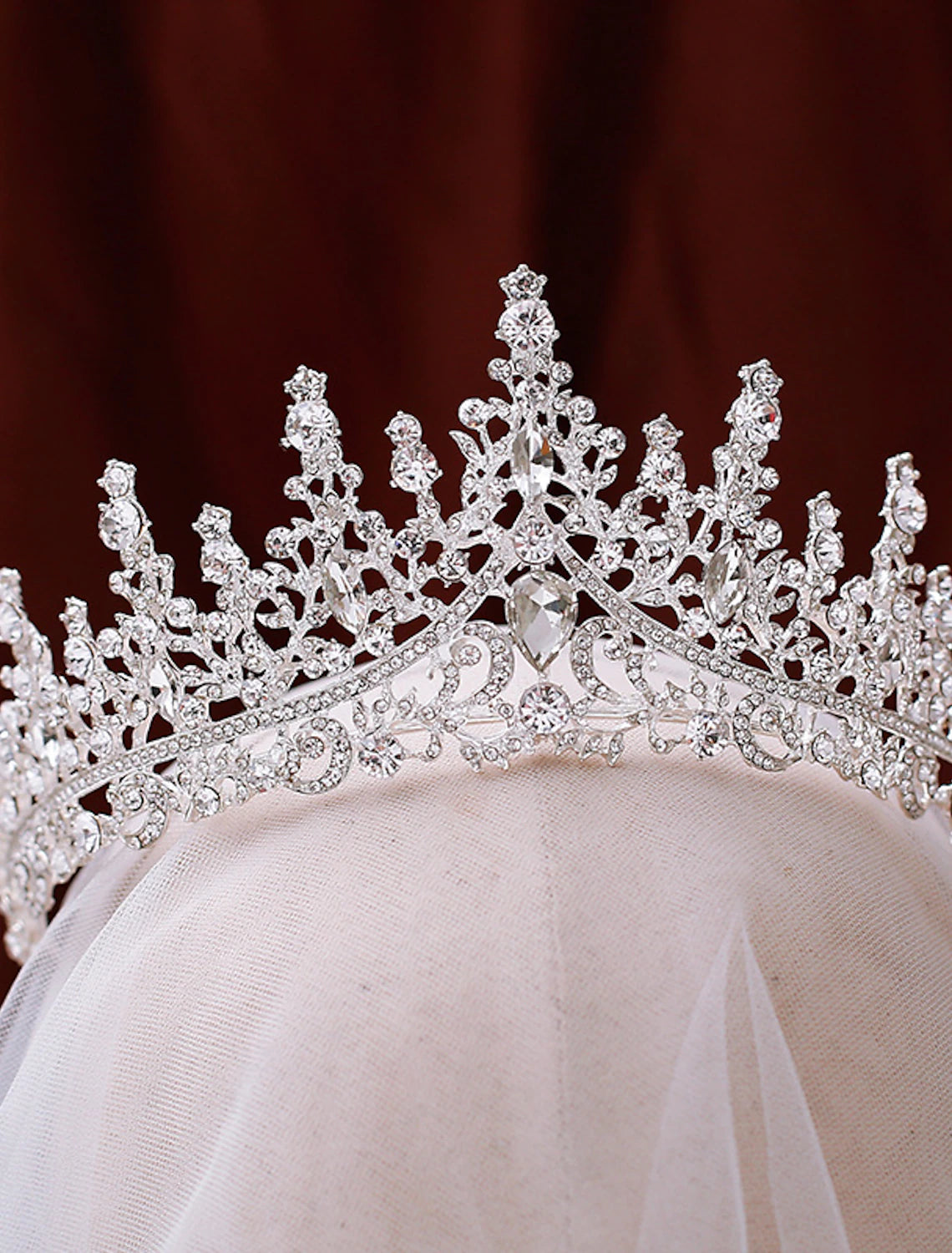 Elegant rhinestone crown tiara with intricate design.