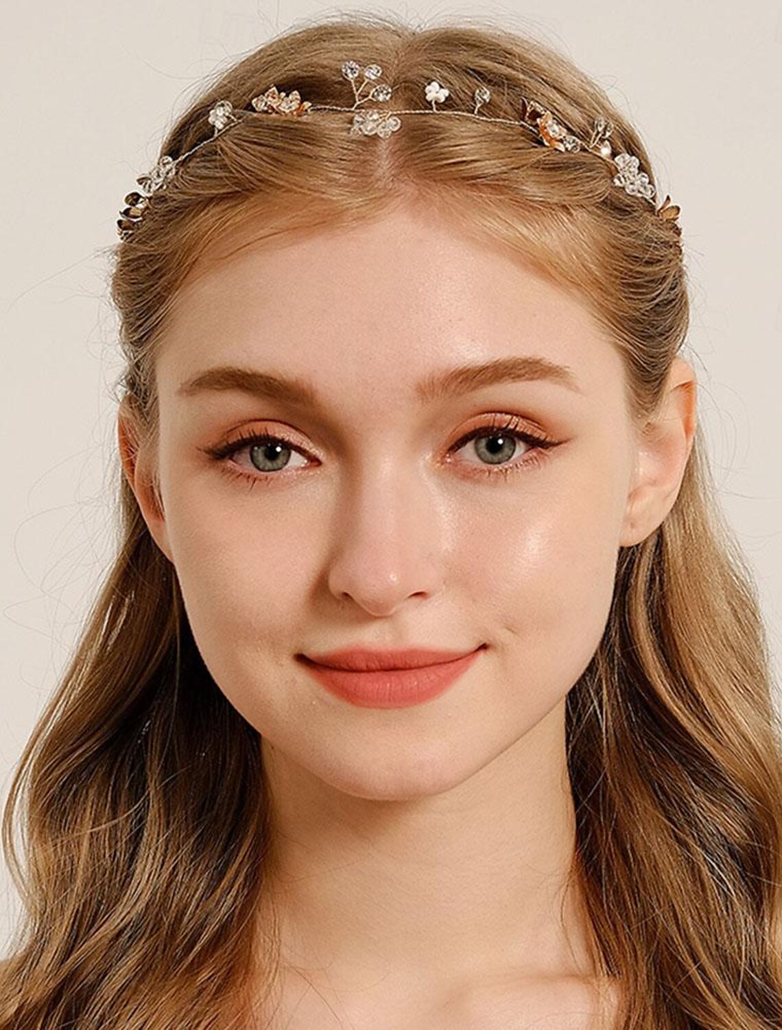 Close-up of a luxury rhinestone wedding tiara with intricate crystal details.