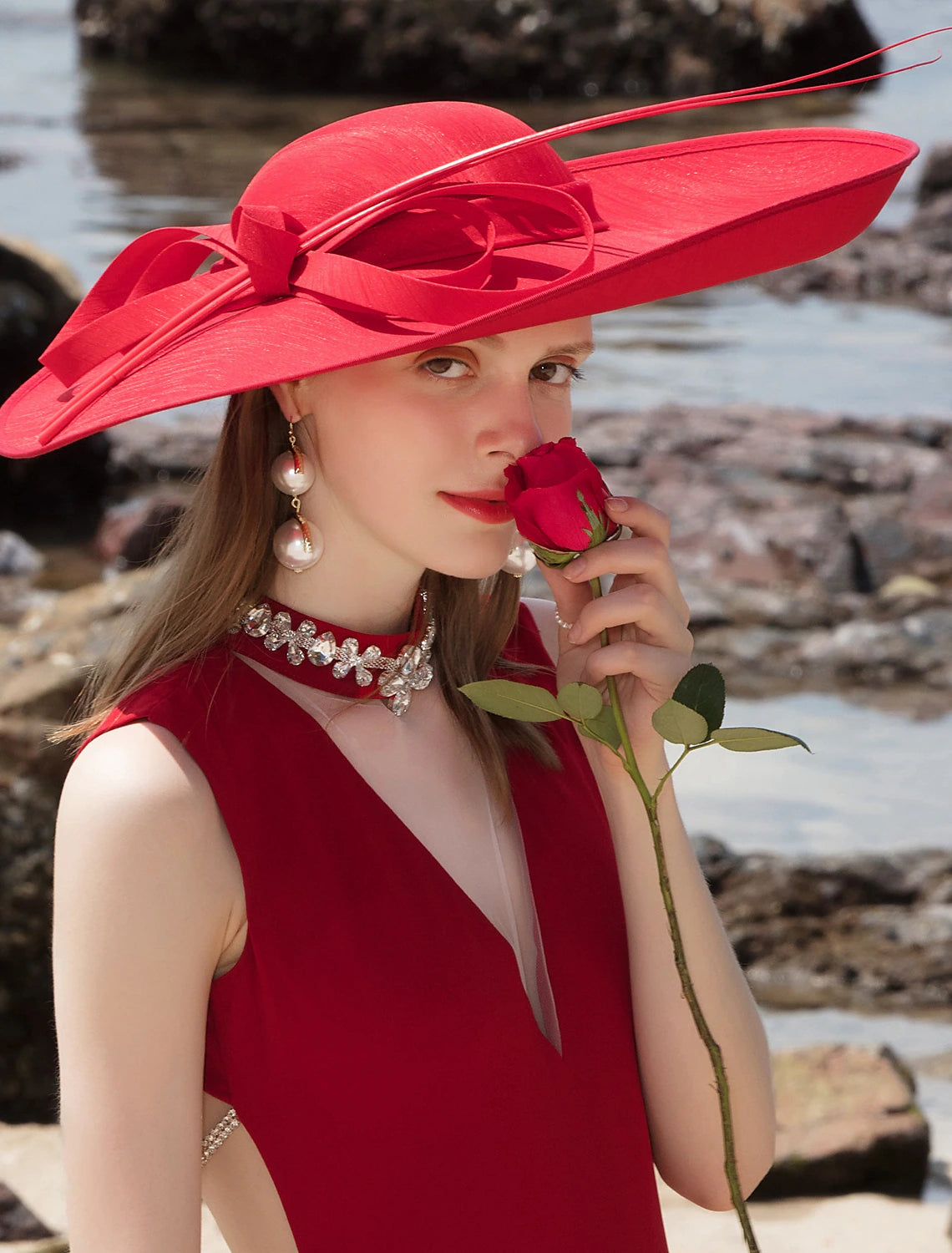 Woman wearing a white double layer bowler cloche hat with a bowknot.