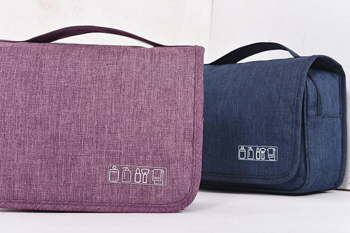 Open black toiletry bag showing interior compartments.