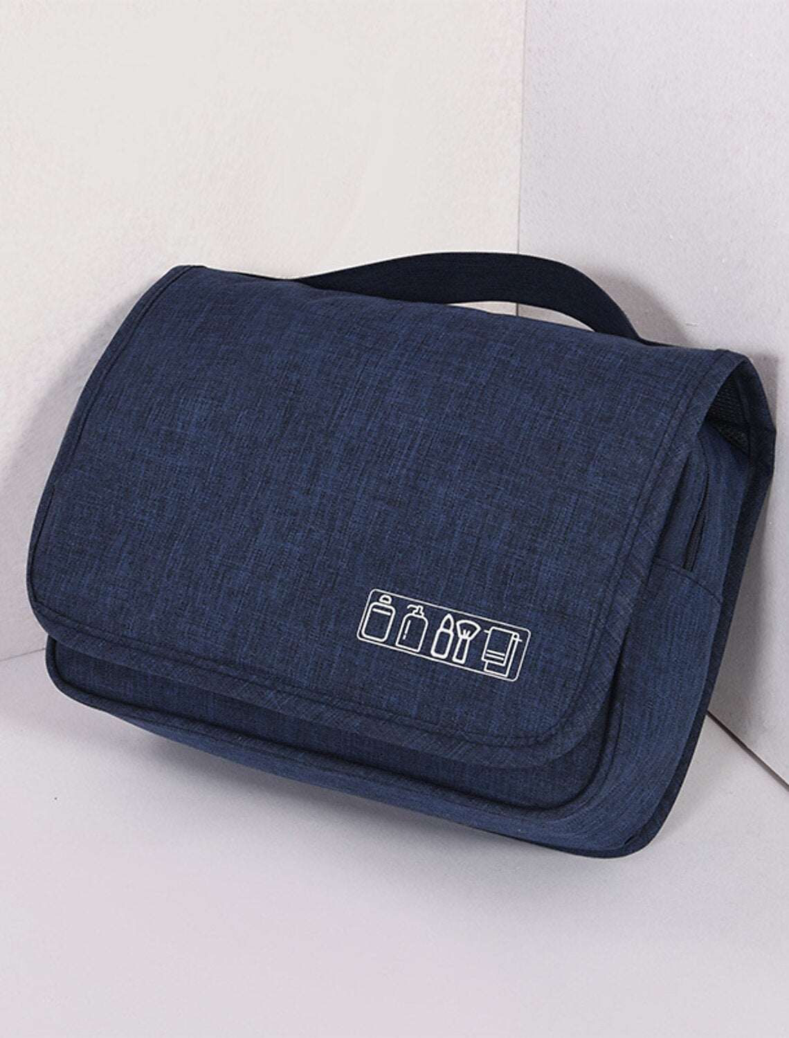 Black toiletry bag filled with various grooming essentials.