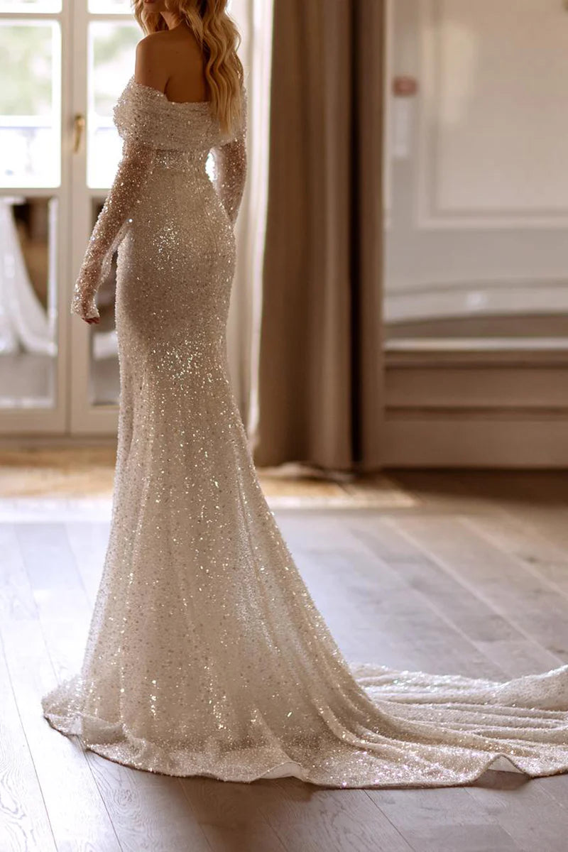 Side view of a bride in a Mermaid Boho Wedding Dress, showcasing the silhouette.