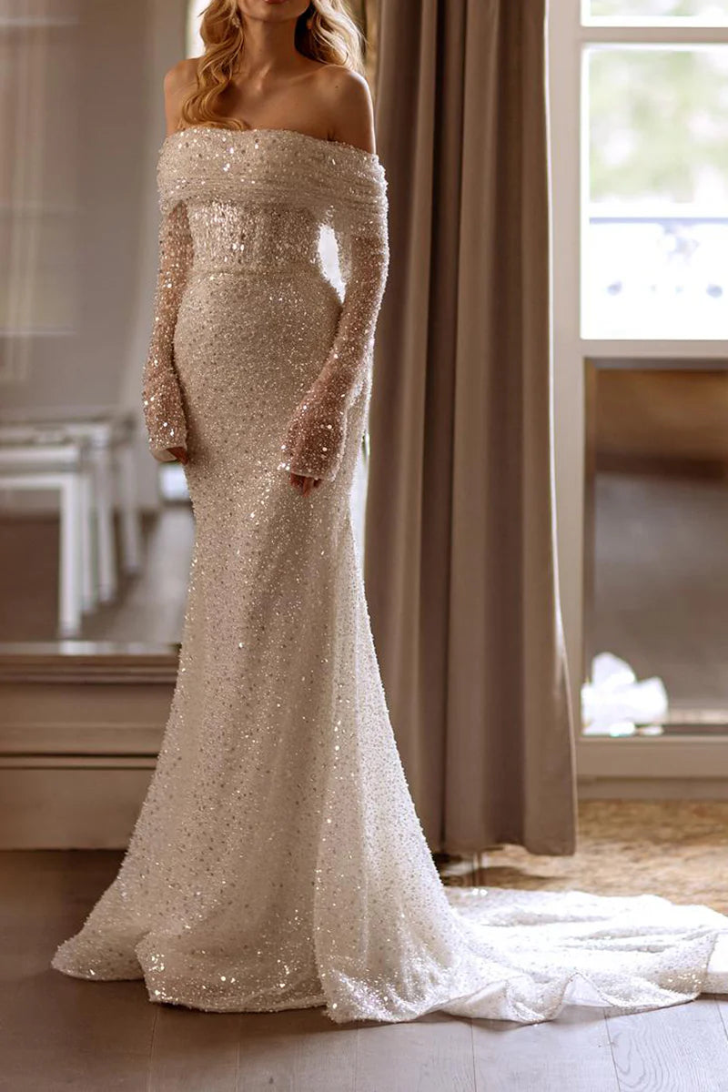 Back view of a bride wearing the Mermaid Boho Bridal Gown with elegant detachable sleeves.