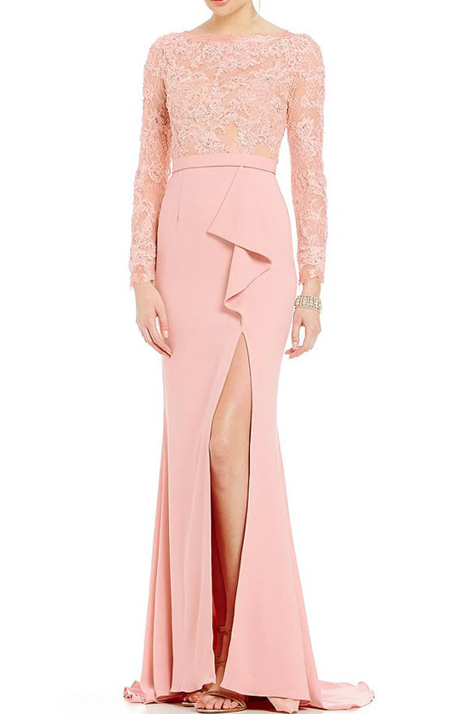 Elegant woman wearing a mermaid long sleeve mother of the bride dress.