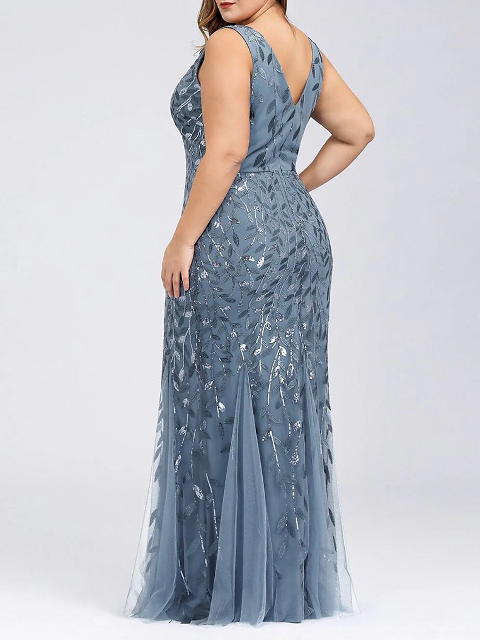 Mermaid sequined formal dress, sleeveless, showcasing intricate sequin details and silhouette.