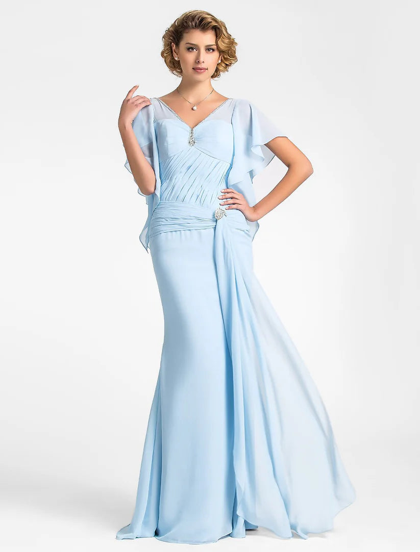 Model wearing a vintage-inspired mermaid trumpet mother of the bride dress with V-neck and short sleeves.
