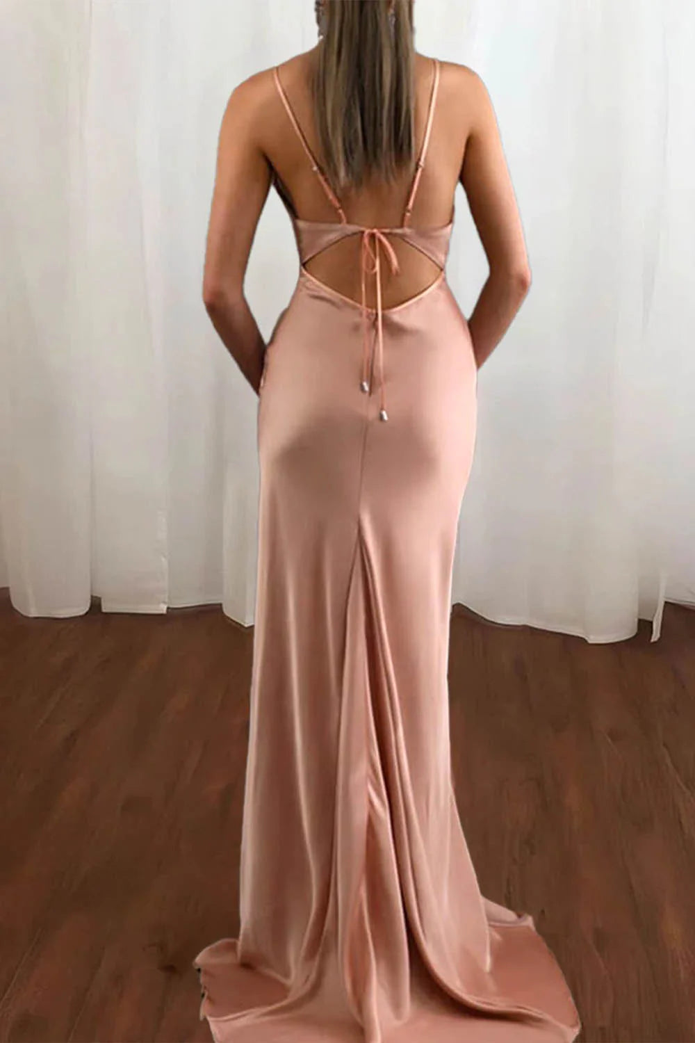 Model wearing a mermaid V-neck satin long prom dress.