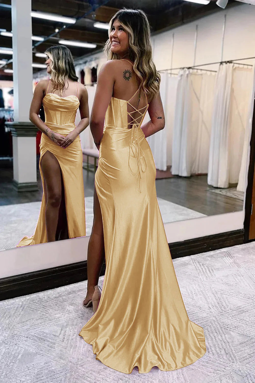 Back view of a mermaid satin prom dress with spaghetti straps.
