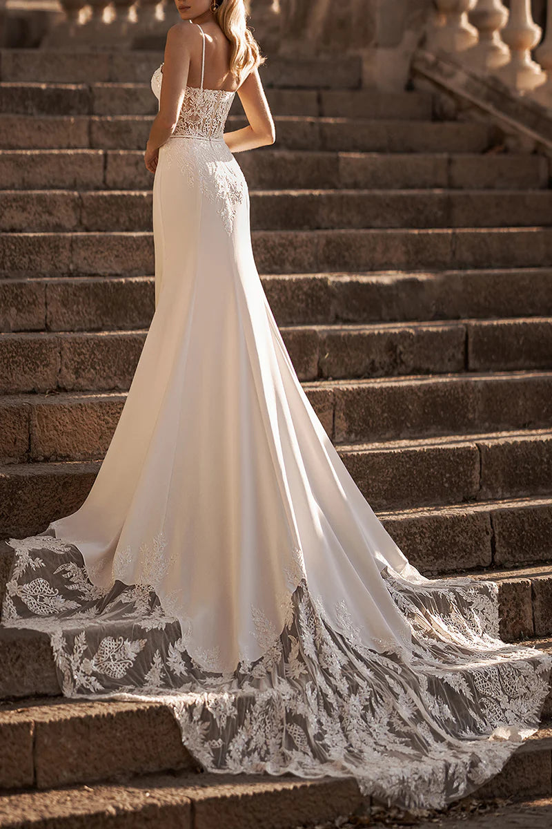 Back view of a mermaid wedding dress showcasing a flowing court train.