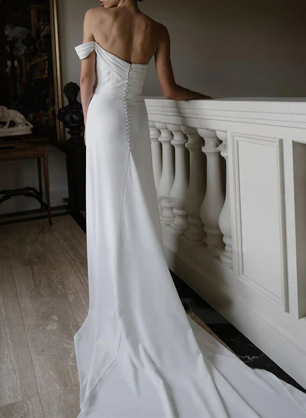 Back view of a woman in a one-shoulder satin wedding dress, showcasing the elegant silhouette.