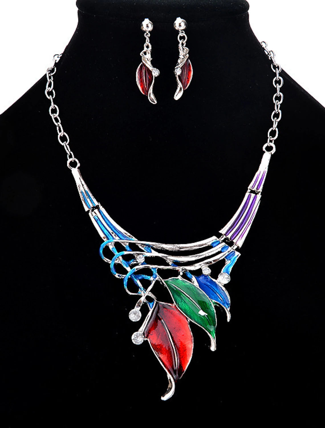 Close-up of multi-color crystal leaf drop earrings.