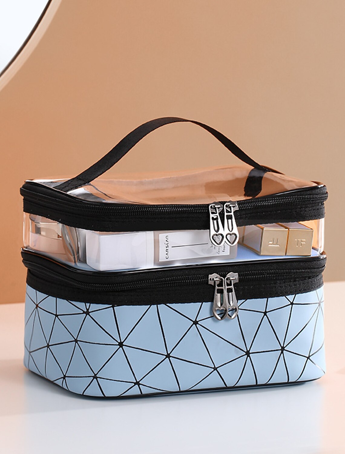 Clear waterproof cosmetic bag for travel essentials.